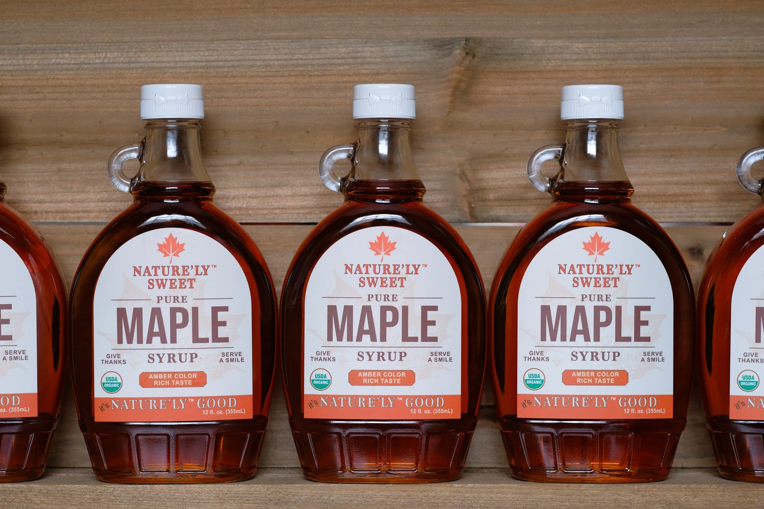 12oz bottles of Organic maple syrup on shelf